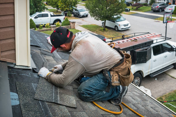 Professional Roofing technician working in Dana, IA